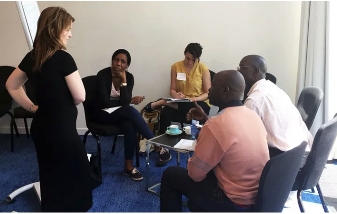 Group of people meeting around a table